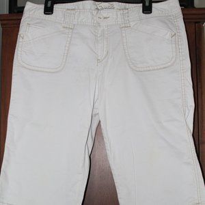 white capris with tan stitching